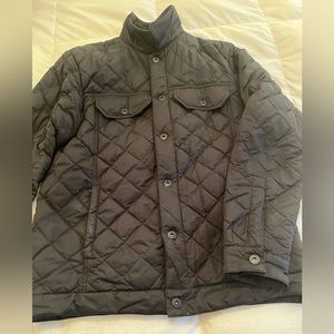 Selling a quilted men’s north face casual jacket with two breast pockets